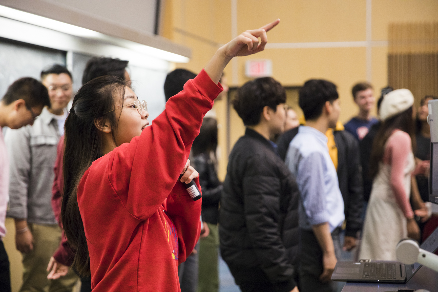 A student speaking at a UBC A Cappella meeting.