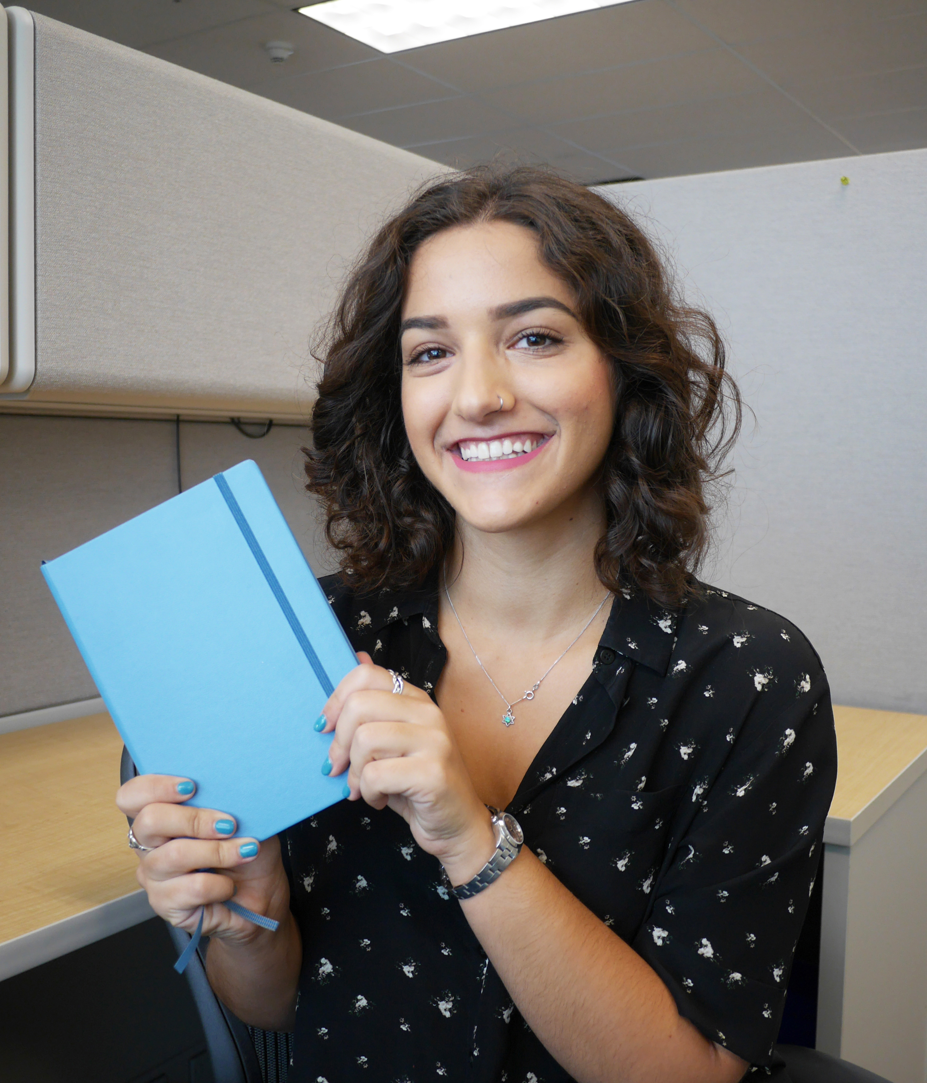 Emily holding her bullet journal