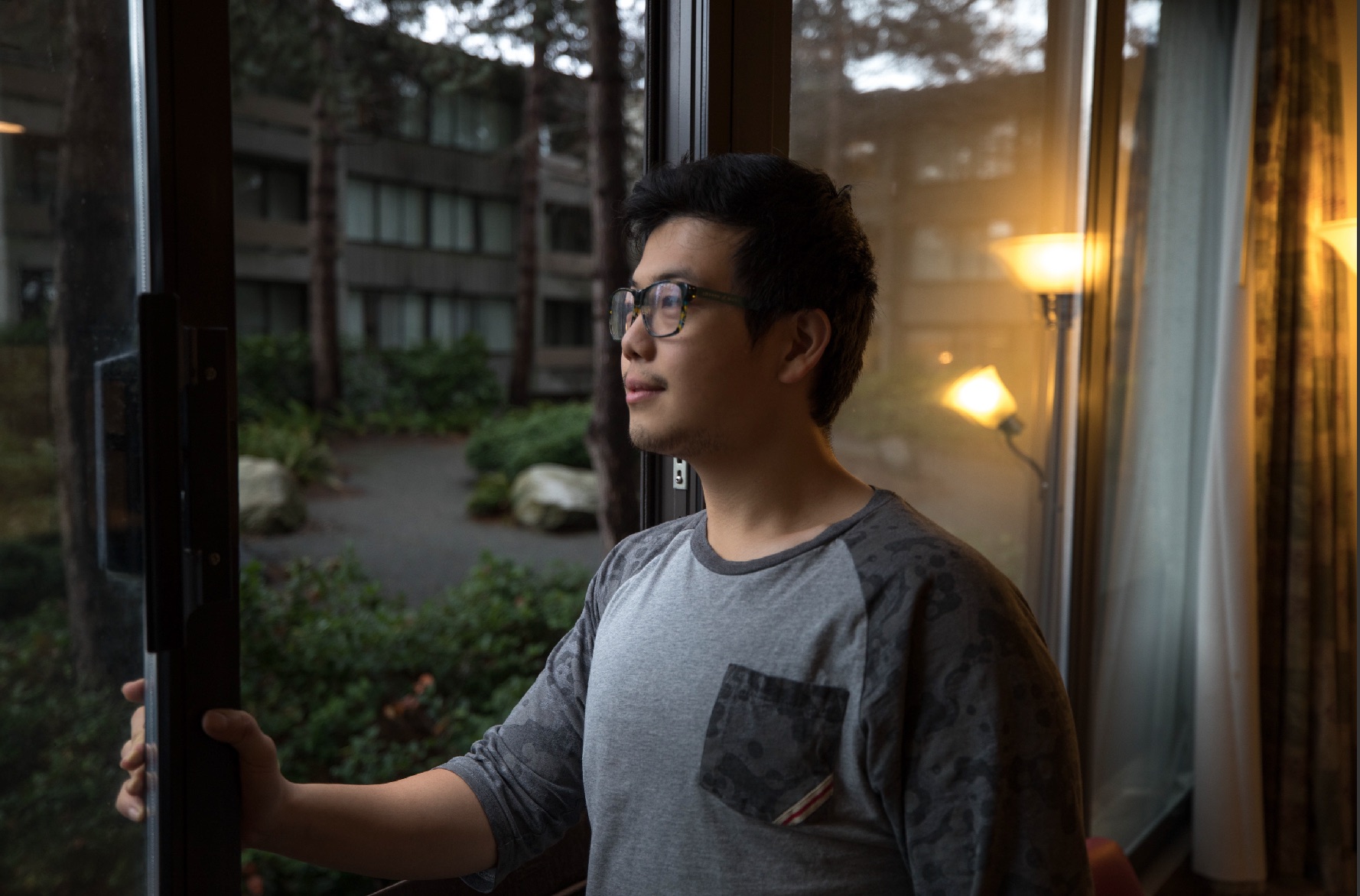 student standing by the window