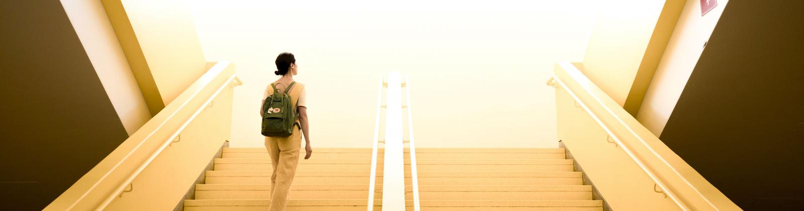 Student going up the stairs