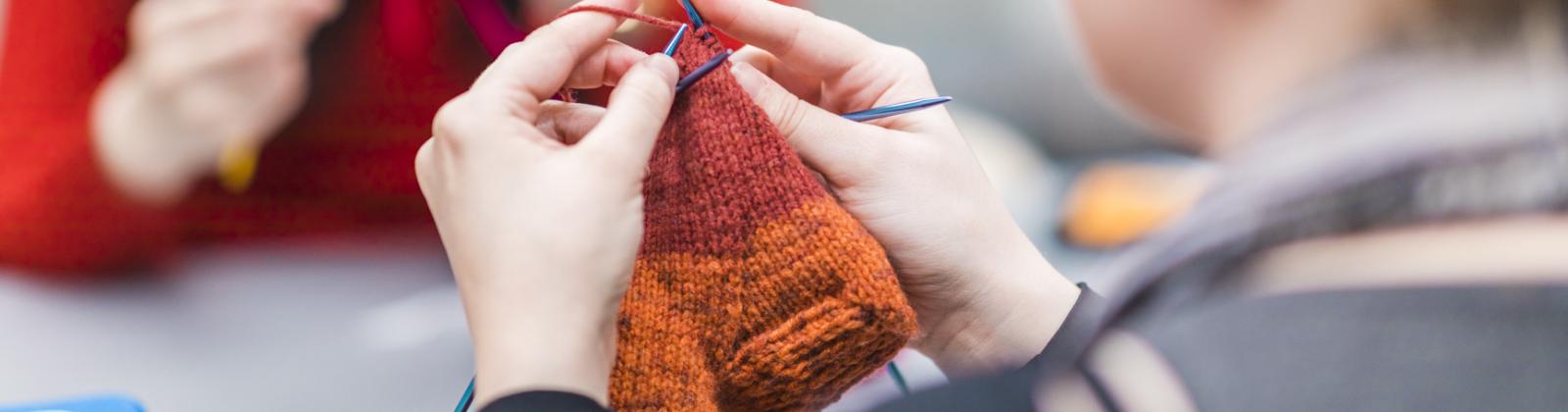 student knitting